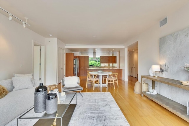 210 Lee Barton Dr Unit 308, Austin, TX 78704 - living area featuring light wood-type flooring and visible vents