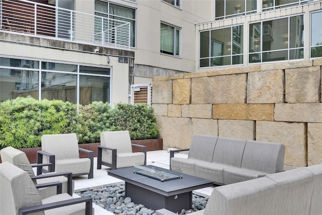 210 Lee Barton Dr Unit 308, Austin, TX 78704 - view of patio / terrace with an outdoor living space with a fire pit
