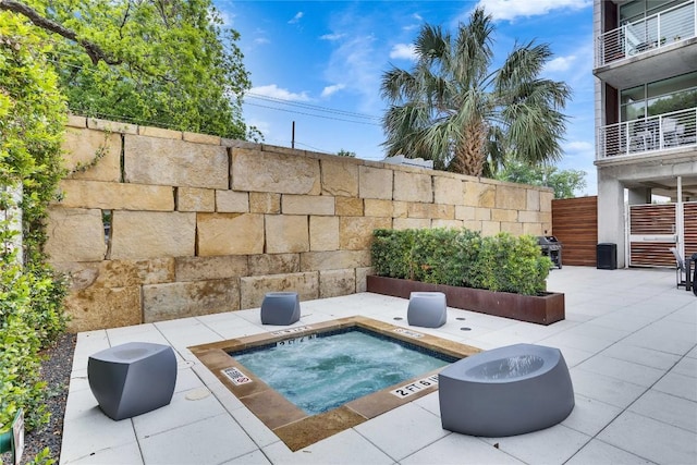 210 Lee Barton Dr Unit 308, Austin, TX 78704 - exterior space with a hot tub and a patio area