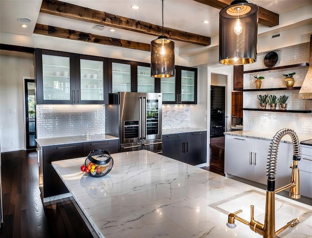 2121 Camino Way, Canyon Lake, TX 78133 - kitchen with stainless steel fridge with ice dispenser, tasteful backsplash, light stone countertops, pendant lighting, and beam ceiling