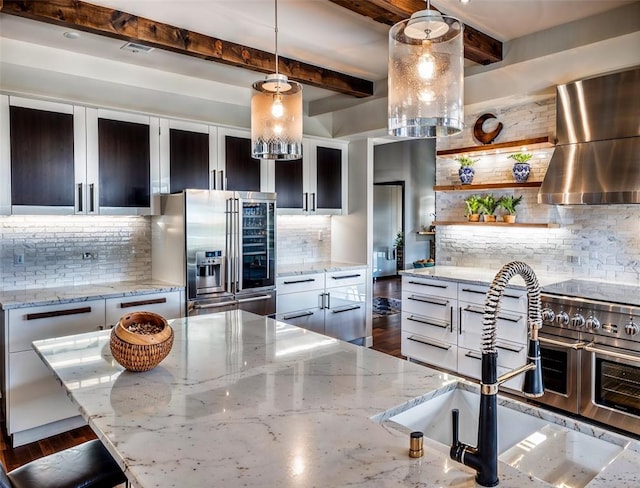 2121 Camino Way, Canyon Lake, TX 78133 - kitchen featuring stainless steel appliances, exhaust hood, tasteful backsplash, open shelves, and pendant lighting