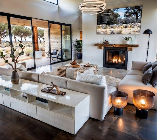 2121 Camino Way, Canyon Lake, TX 78133 - living room featuring a glass covered fireplace and a chandelier