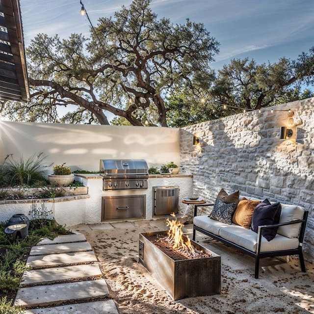 2121 Camino Way, Canyon Lake, TX 78133 - view of patio / terrace with area for grilling and an outdoor living space with a fire pit