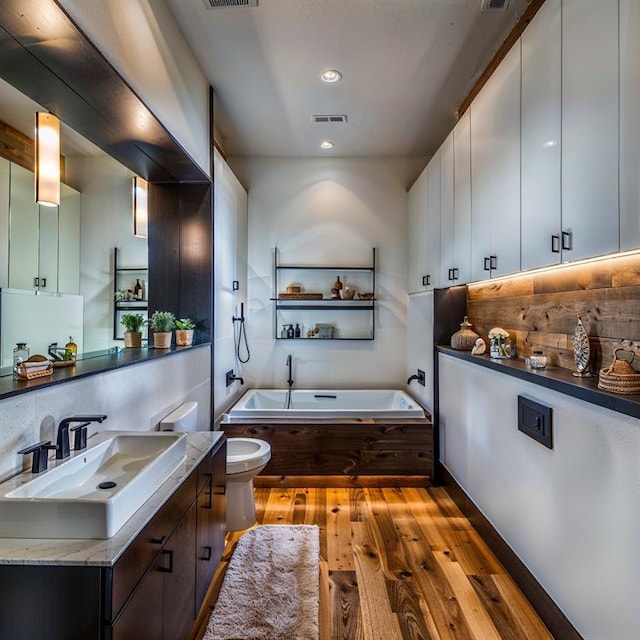 2121 Camino Way, Canyon Lake, TX 78133 - full bathroom featuring vanity, a bath, wood finished floors, tasteful backsplash, and recessed lighting