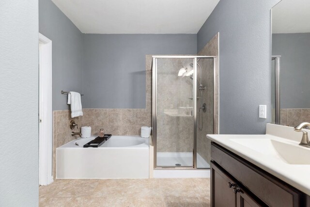 464 Evening Star, Kyle, TX 78640 - bathroom featuring a bath, a stall shower, and vanity