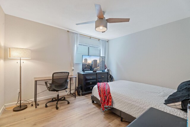 9706 Woodshire Dr, Austin, TX 78748 - bedroom with wood finished floors, a desk, and a ceiling fan