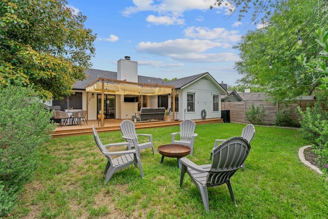 9706 Woodshire Dr, Austin, TX 78748 - back of property with a jacuzzi, a wooden deck, a chimney, a fire pit, and roof with shingles