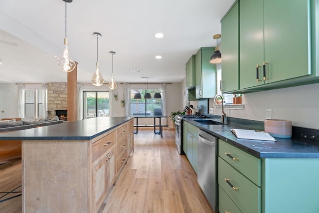 9706 Woodshire Dr, Austin, TX 78748 - kitchen with green cabinets, appliances with stainless steel finishes, dark countertops, a kitchen island, and recessed lighting