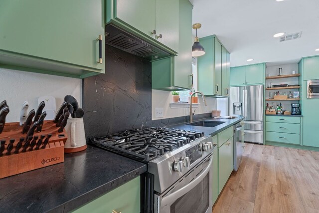 9706 Woodshire Dr, Austin, TX 78748 - kitchen featuring green cabinets, appliances with stainless steel finishes, custom exhaust hood, open shelves, and recessed lighting