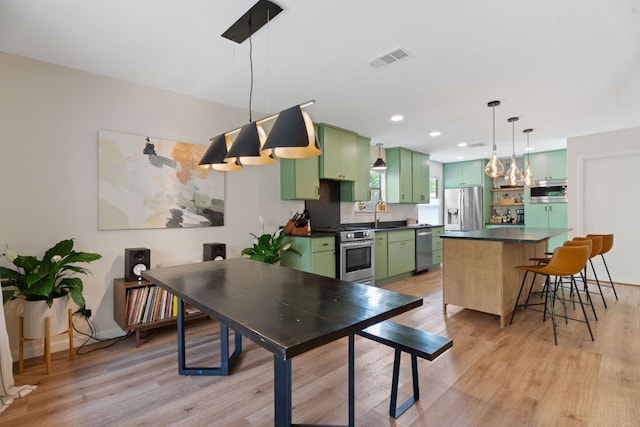 9706 Woodshire Dr, Austin, TX 78748 - dining area with light wood-style flooring and recessed lighting