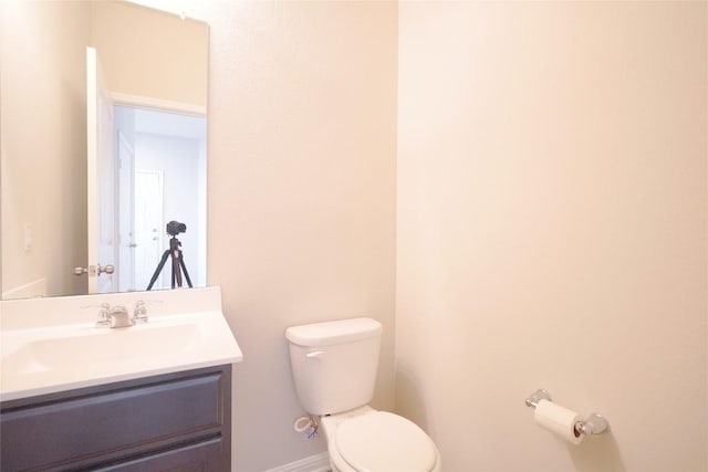 516 E Slaughter Ln Unit 2003, Austin, TX 78744 - half bathroom with toilet, vanity, and baseboards