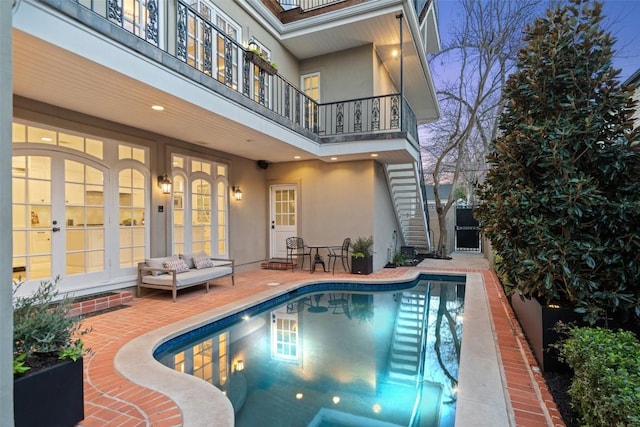 outdoor pool featuring a patio area