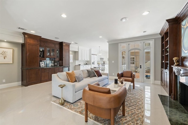 living room with light tile patterned flooring, baseboards, visible vents, and recessed lighting