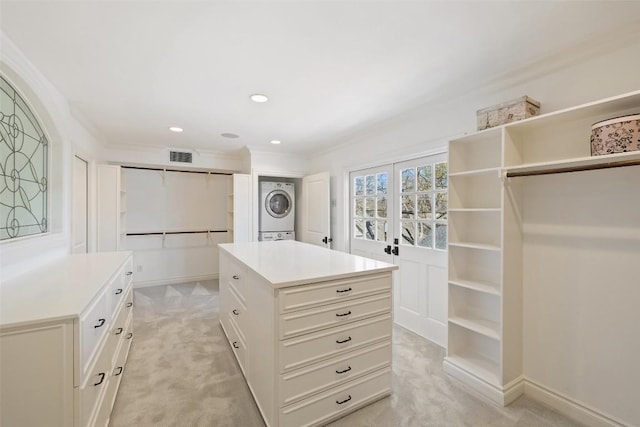 1810 W 35th St, Austin, TX 78703 - walk in closet with stacked washer and clothes dryer and light colored carpet
