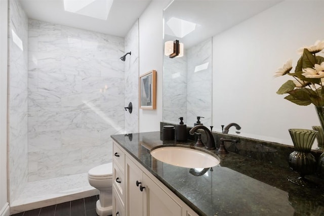 1810 W 35th St, Austin, TX 78703 - full bathroom with a skylight, vanity, and a tile shower