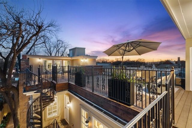 deck at dusk featuring stairway