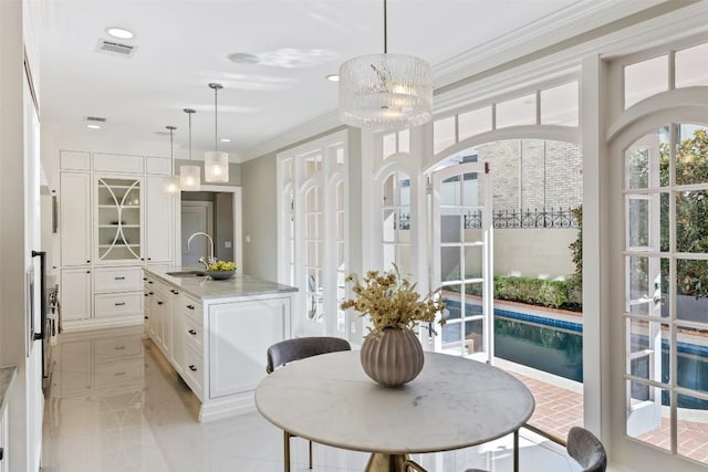 1810 W 35th St, Austin, TX 78703 - dining space with crown molding, light tile patterned flooring, and recessed lighting