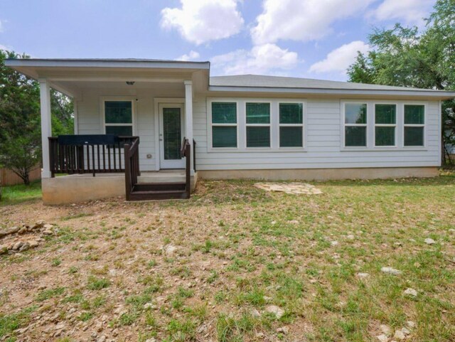 21711 Crystal Way, Lago Vista, TX 78645 - view of front of house featuring a porch and a front lawn