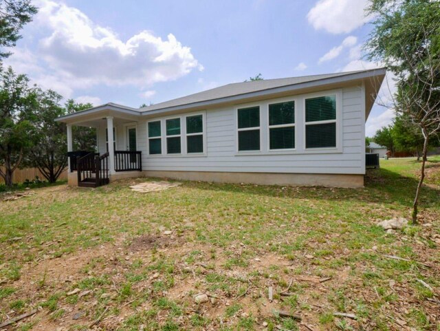 21711 Crystal Way, Lago Vista, TX 78645 - back of house with a yard and a porch