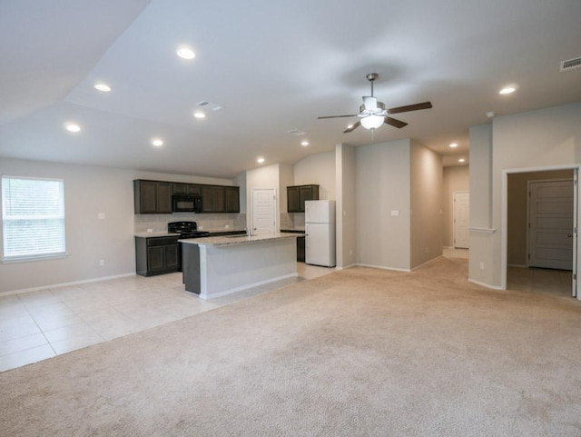 21711 Crystal Way, Lago Vista, TX 78645 - unfurnished living room featuring recessed lighting, light carpet, ceiling fan, and light tile patterned floors