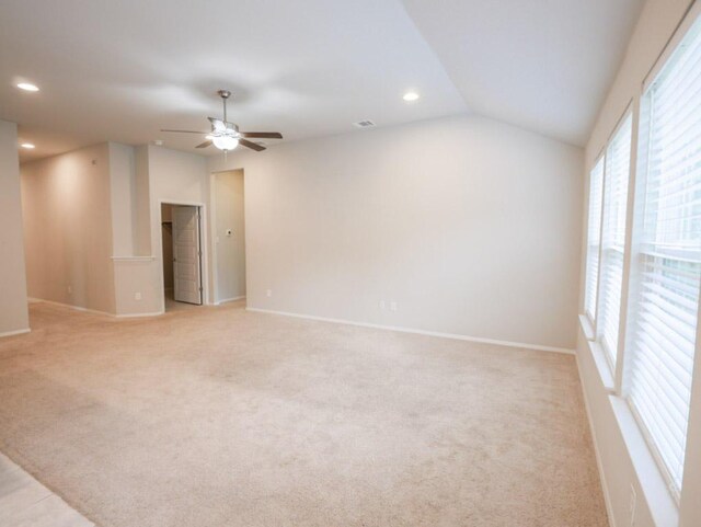 21711 Crystal Way, Lago Vista, TX 78645 - empty room with ceiling fan, vaulted ceiling, recessed lighting, and light carpet