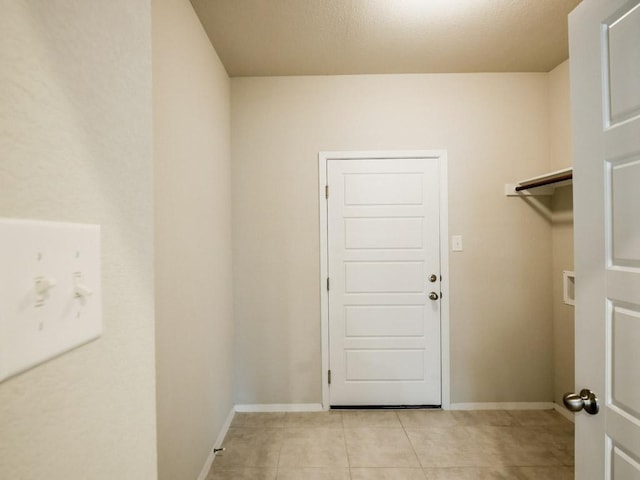 21711 Crystal Way, Lago Vista, TX 78645 - laundry area with light tile patterned floors and hookup for a washing machine