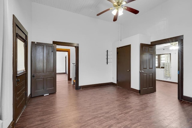 2705 E 2nd St, Austin, TX 78702 - spare room with dark wood-type flooring, high vaulted ceiling, baseboards, and a ceiling fan