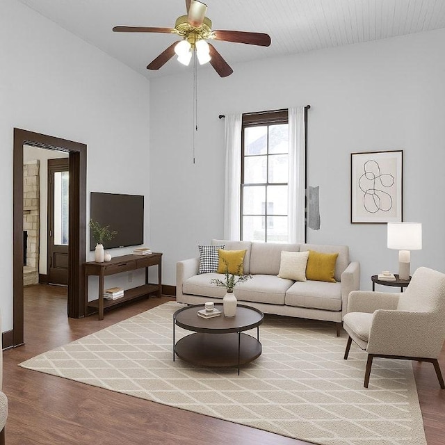 2705 E 2nd St, Austin, TX 78702 - living area with wood finished floors, ceiling fan, lofted ceiling, and baseboards