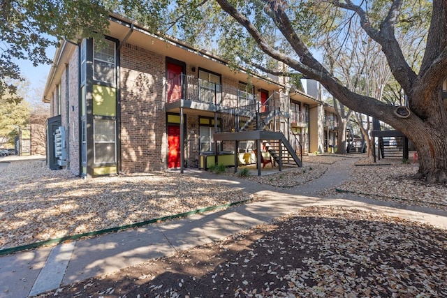 7685 Northcross Dr Unit 728, Austin, TX 78757 - view of building exterior with stairway