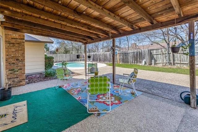 view of patio / terrace with a fenced backyard and a fenced in pool