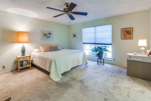 10116 Willfield Dr, Austin, TX 78753 - bedroom with carpet floors, ceiling fan, baseboards, and a textured ceiling