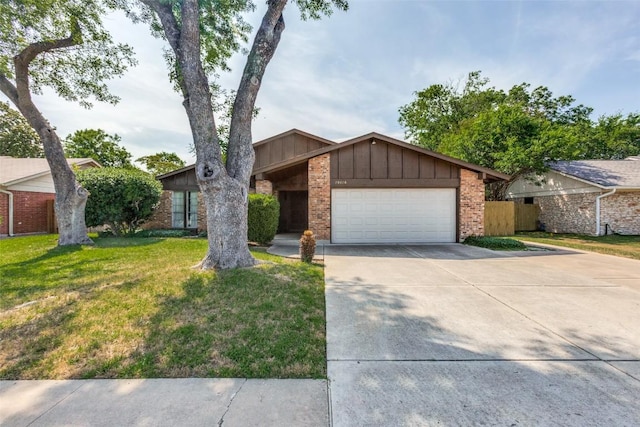 10116 Willfield Dr, Austin, TX 78753 - mid-century modern home featuring brick siding, board and batten siding, an attached garage, and concrete driveway