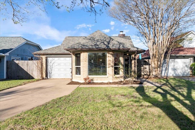 14300 Anita Marie Ln, Austin, TX 78728 - view of front facade with a chimney, an attached garage, concrete driveway, stone siding, and roof with shingles