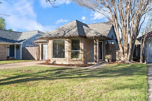 14300 Anita Marie Ln, Austin, TX 78728 - view of front facade with concrete driveway, brick siding, and a shingled roof