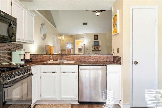 14300 Anita Marie Ln, Austin, TX 78728 - kitchen featuring black appliances, tasteful backsplash, white cabinetry, and dark stone counters