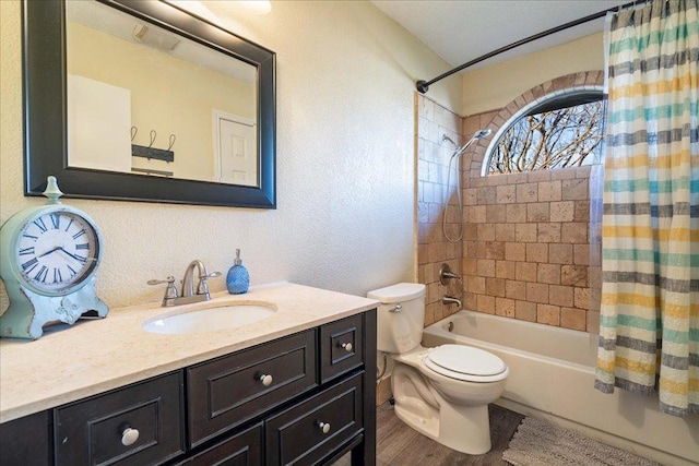 14300 Anita Marie Ln, Austin, TX 78728 - bathroom with shower / bathtub combination with curtain, vanity, a textured wall, and wood finished floors