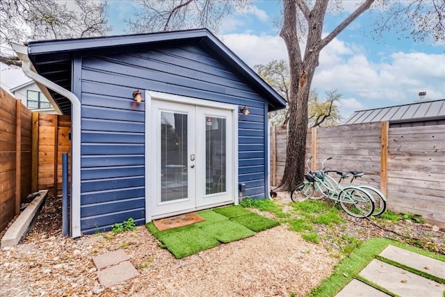 203 Ben Howell Dr, Austin, TX 78704 - view of outbuilding with french doors and a fenced backyard