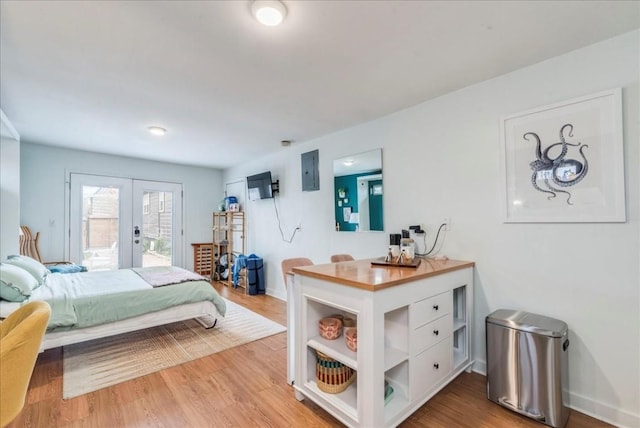 203 Ben Howell Dr, Austin, TX 78704 - bedroom featuring french doors, access to outside, wood finished floors, and electric panel
