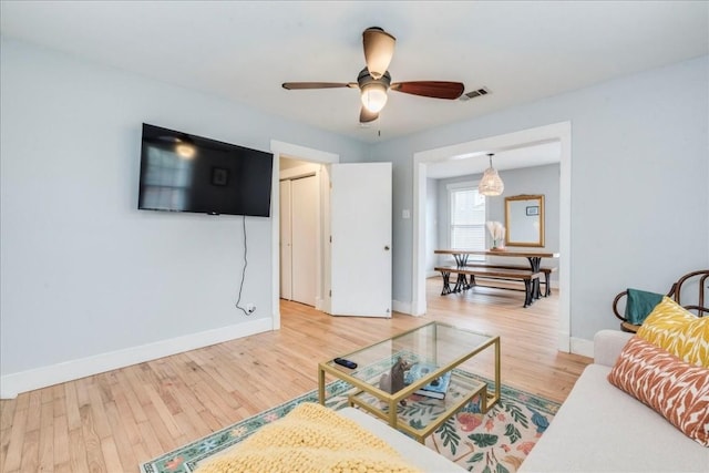 203 Ben Howell Dr, Austin, TX 78704 - living room with wood finished floors and a ceiling fan