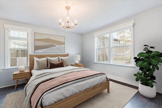 203 Ben Howell Dr, Austin, TX 78704 - bedroom with a chandelier and wood finished floors