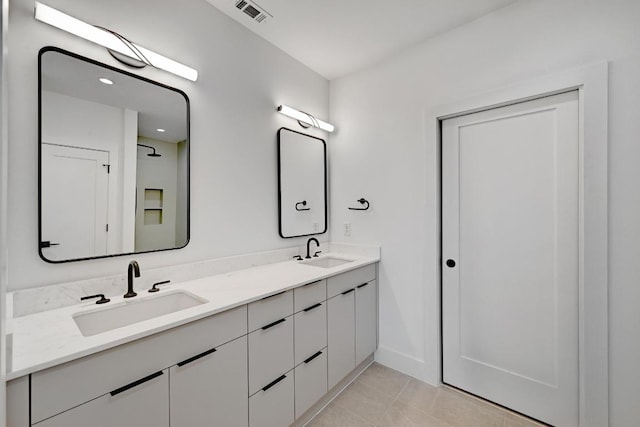4703 Mount Vernon Dr Unit 1, Austin, TX 78745 - bathroom with double vanity and tile patterned flooring