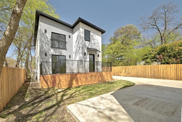 4703 Mount Vernon Dr Unit 1, Austin, TX 78745 - back of house featuring stucco siding and a patio