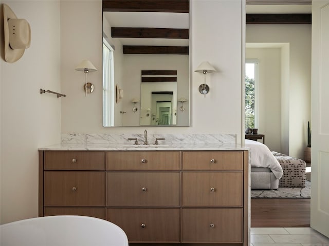 4401 Amarra Dr Unit 14, Austin, TX 78735 - bathroom featuring beamed ceiling, vanity, a freestanding tub, and connected bathroom
