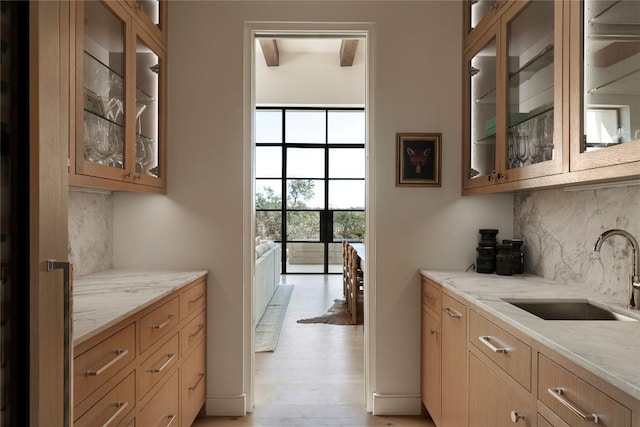 4401 Amarra Dr Unit 14, Austin, TX 78735 - kitchen with decorative backsplash and light stone counters