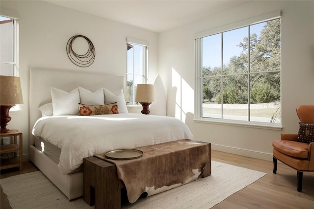 4401 Amarra Dr Unit 14, Austin, TX 78735 - bedroom with multiple windows and light wood finished floors