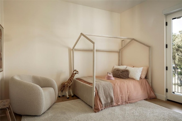 4401 Amarra Dr Unit 14, Austin, TX 78735 - bedroom featuring multiple windows and wood finished floors