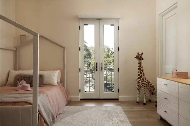 4401 Amarra Dr Unit 14, Austin, TX 78735 - bedroom with access to outside, french doors, and wood finished floors