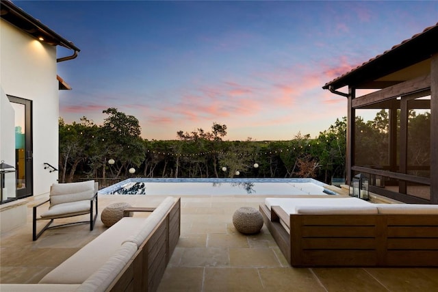 4401 Amarra Dr Unit 14, Austin, TX 78735 - patio terrace at dusk featuring an outdoor hangout area and a patio area