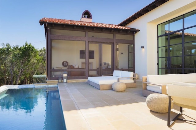 4401 Amarra Dr Unit 14, Austin, TX 78735 - rear view of property with a patio, a tiled roof, stucco siding, and an outdoor pool
