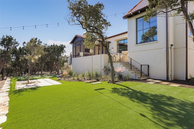 4401 Amarra Dr Unit 14, Austin, TX 78735 - view of green lawn with a sunroom